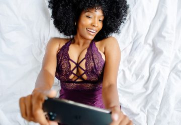 woman taking selfie in lingerie